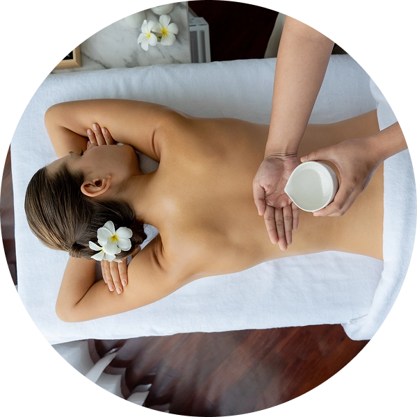 Woman receiving relaxing back massage at spa.