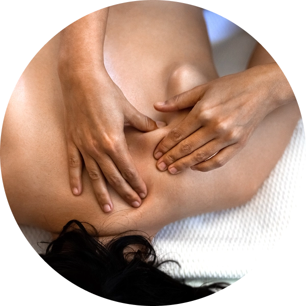 Person receiving a back massage therapy session.