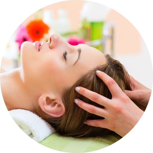 Woman receiving relaxing head massage therapy.