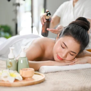 Woman receiving relaxing massage with oils.