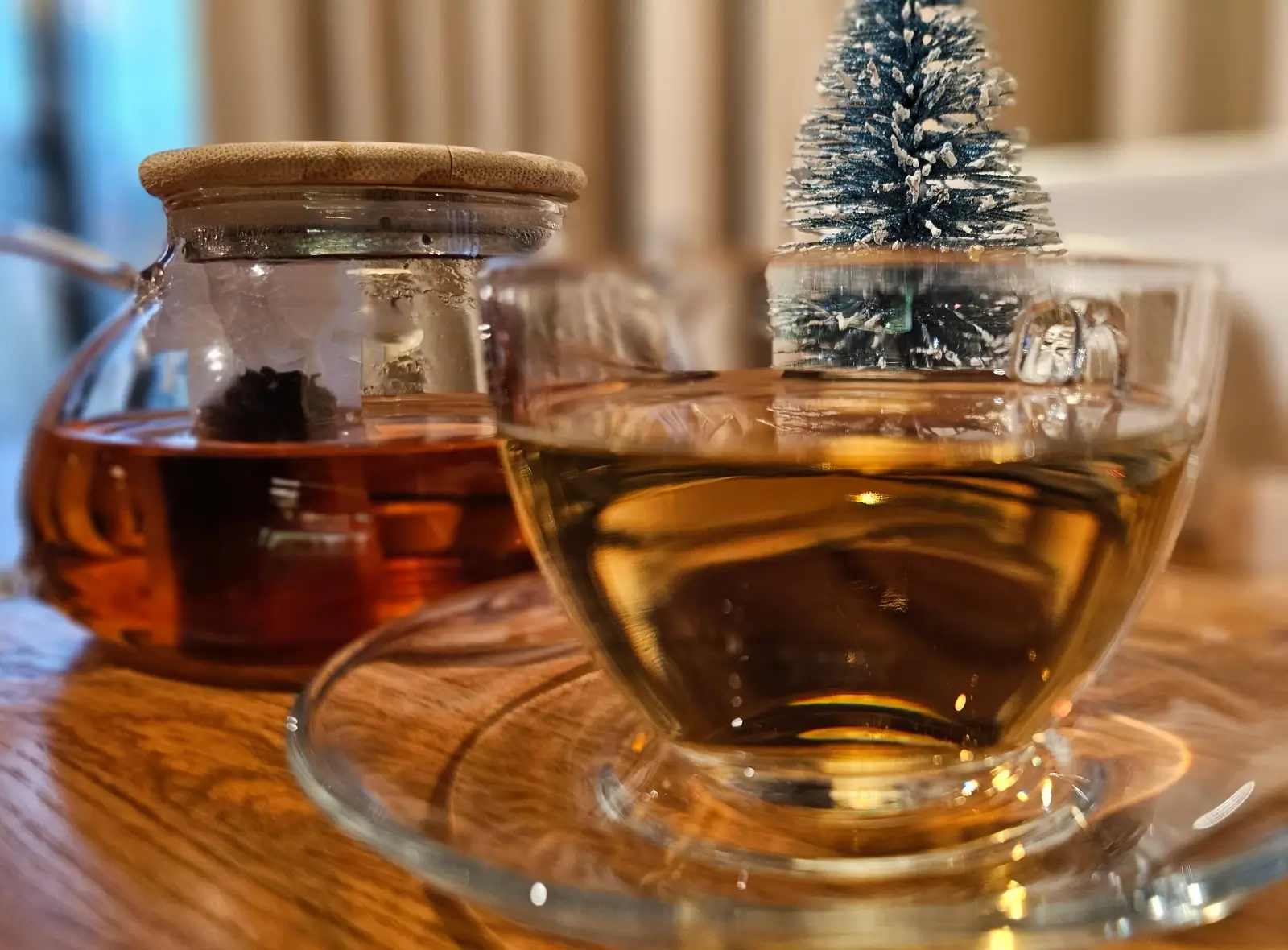 Glass teacup and teapot with mini tree.