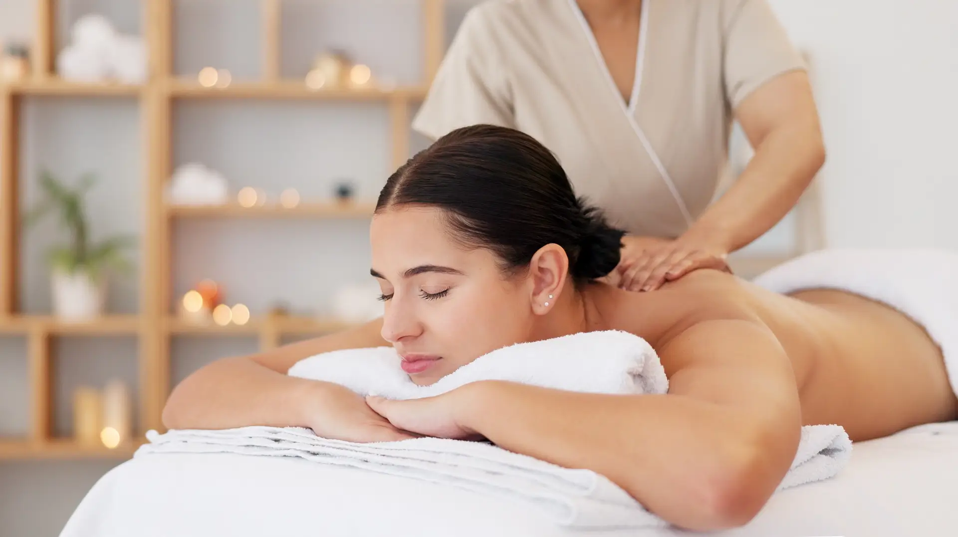 Woman receiving relaxing back massage therapy.