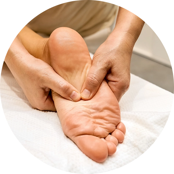 Foot massage with hands applying pressure.