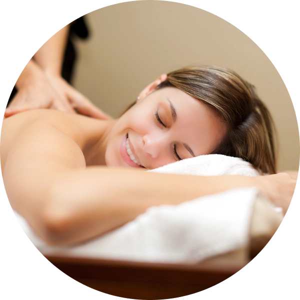 Smiling woman receiving a relaxing massage.